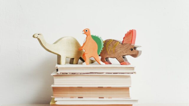 three wooden dinosaur