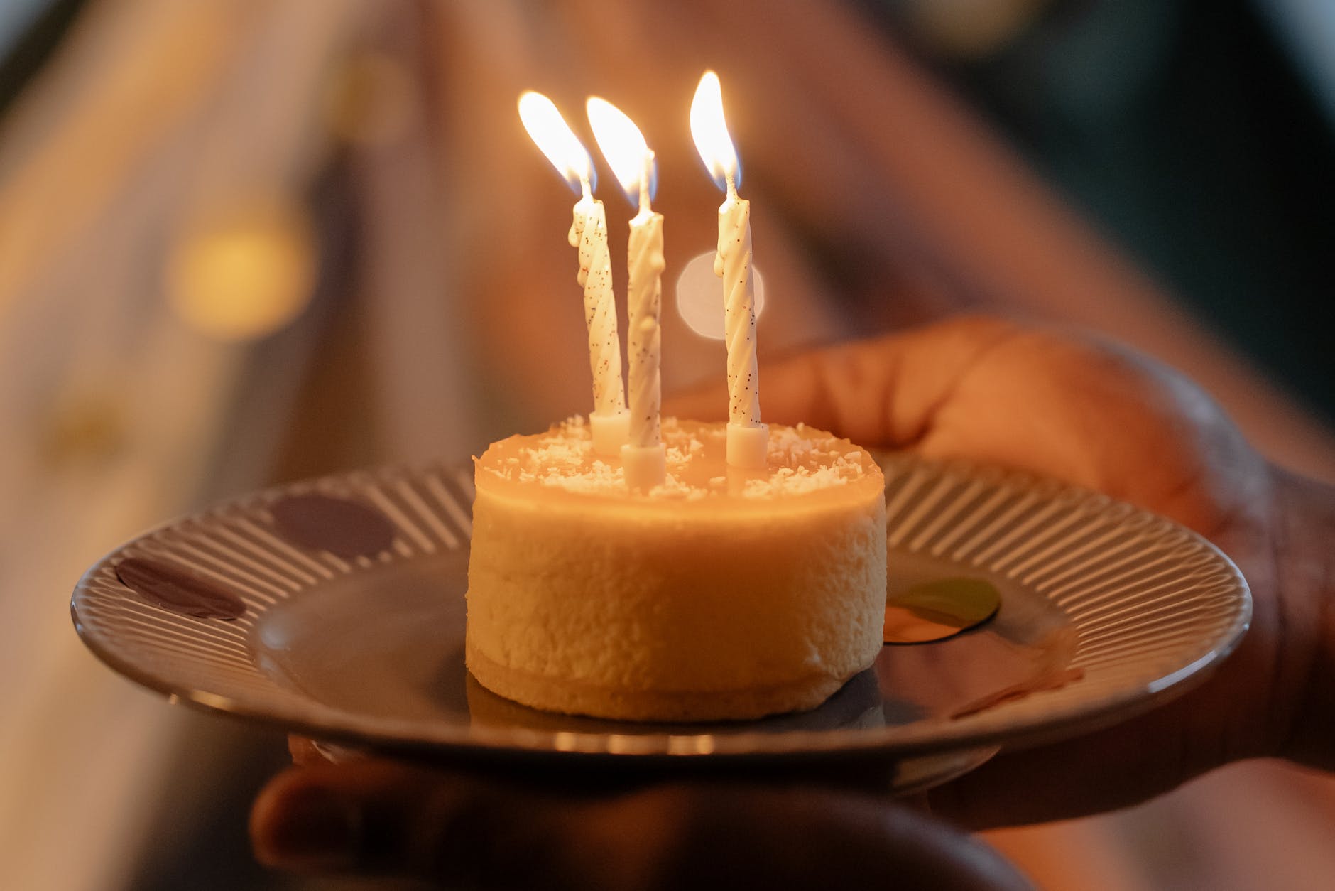 close up photograph of a birthday cake with lit candles