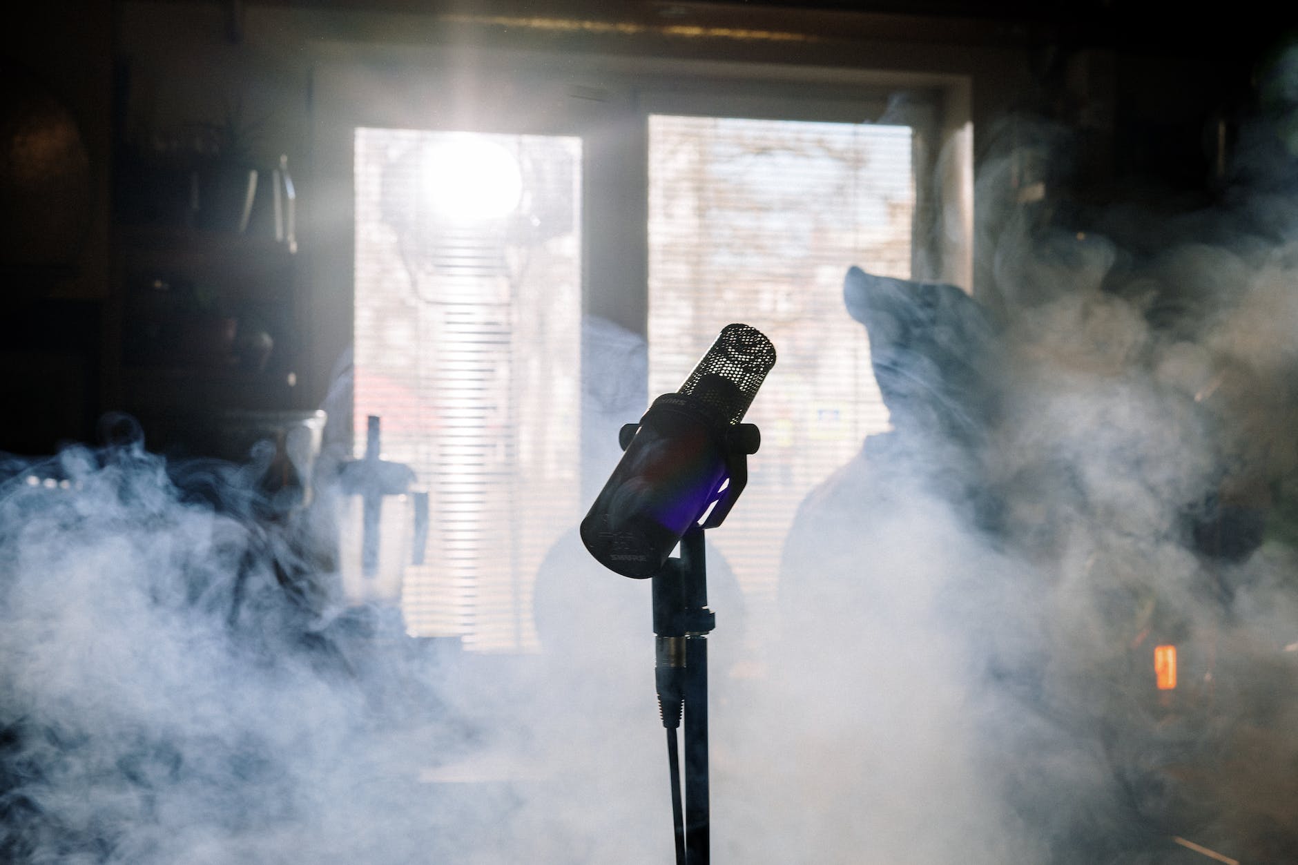 black microphone with stand near white smoke