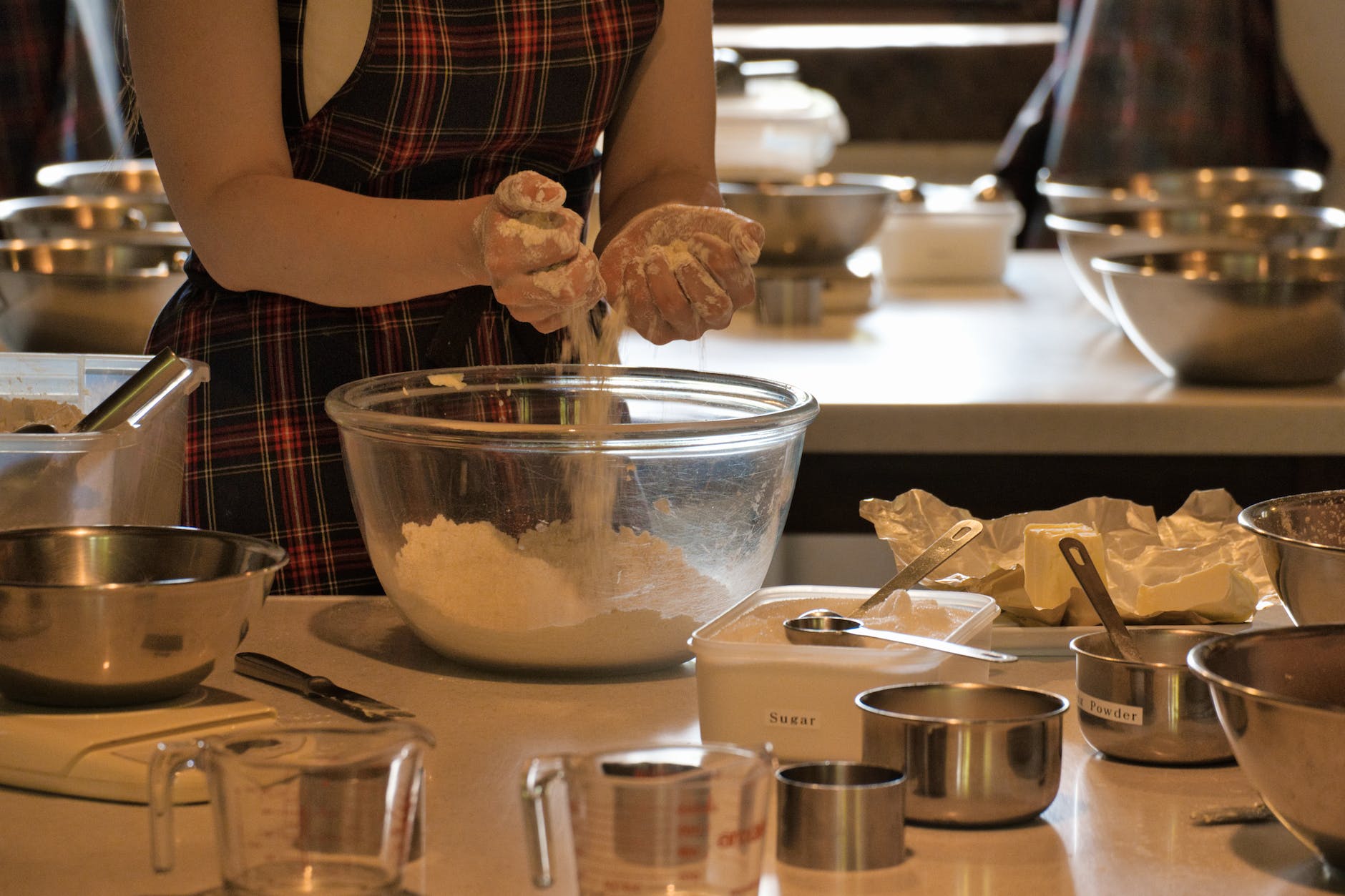 close up of woman preparing a dough at a cooking class